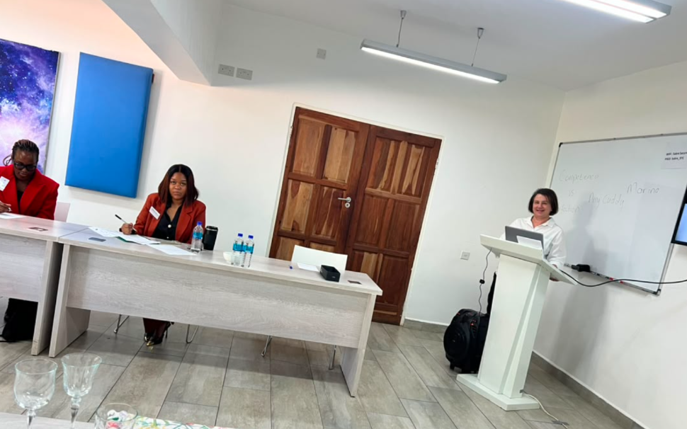 Marina Ramlaul presenting from the lectern during a training session